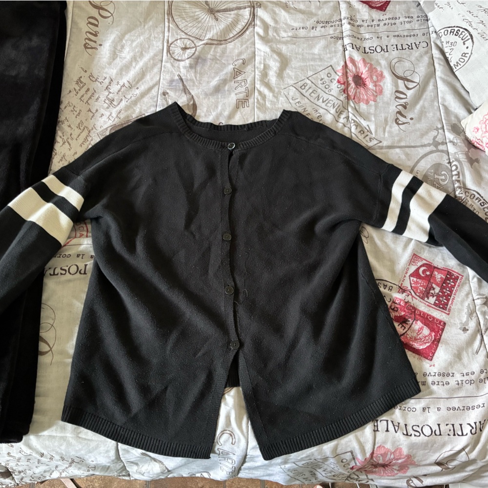 Black sweater with white stripes